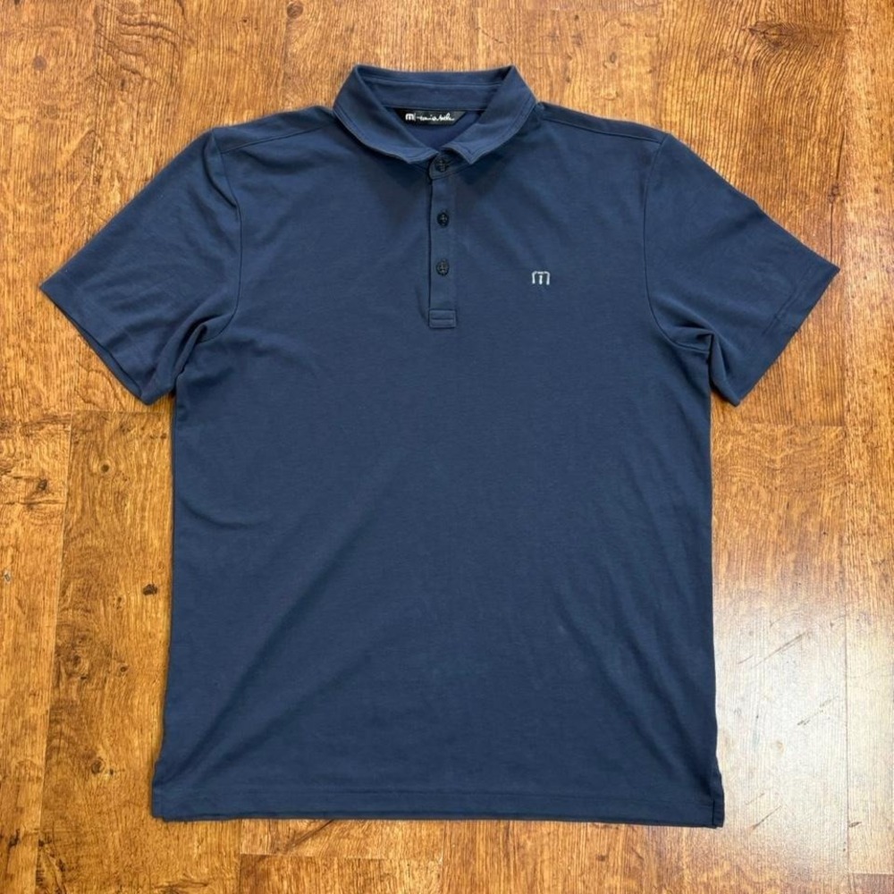 TravisMathew Excursion Knit navy blue golf apparel polo shirt